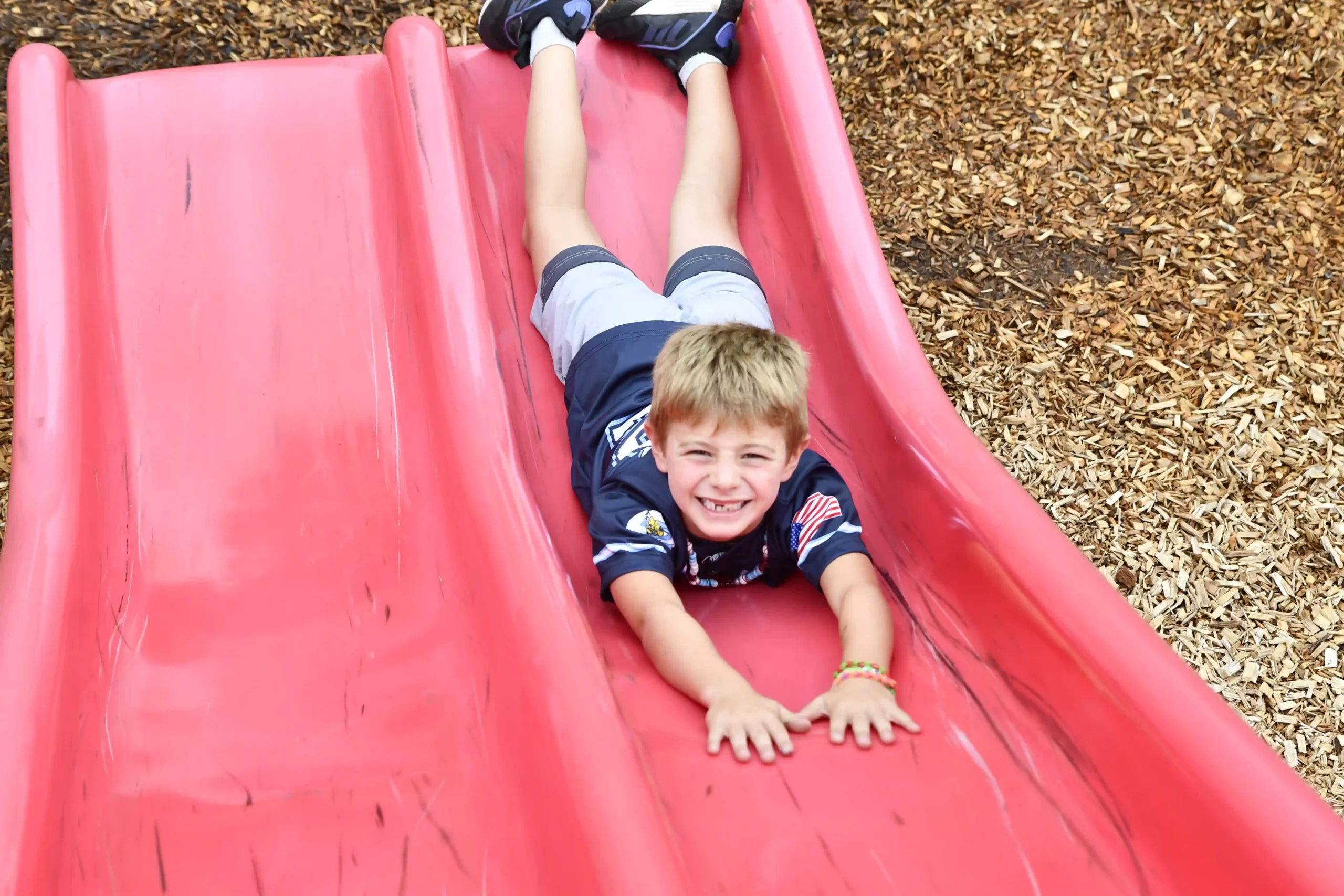 kid-going-down-slide